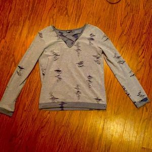 Blue, ripped, v-neck sweater. Lightly used.